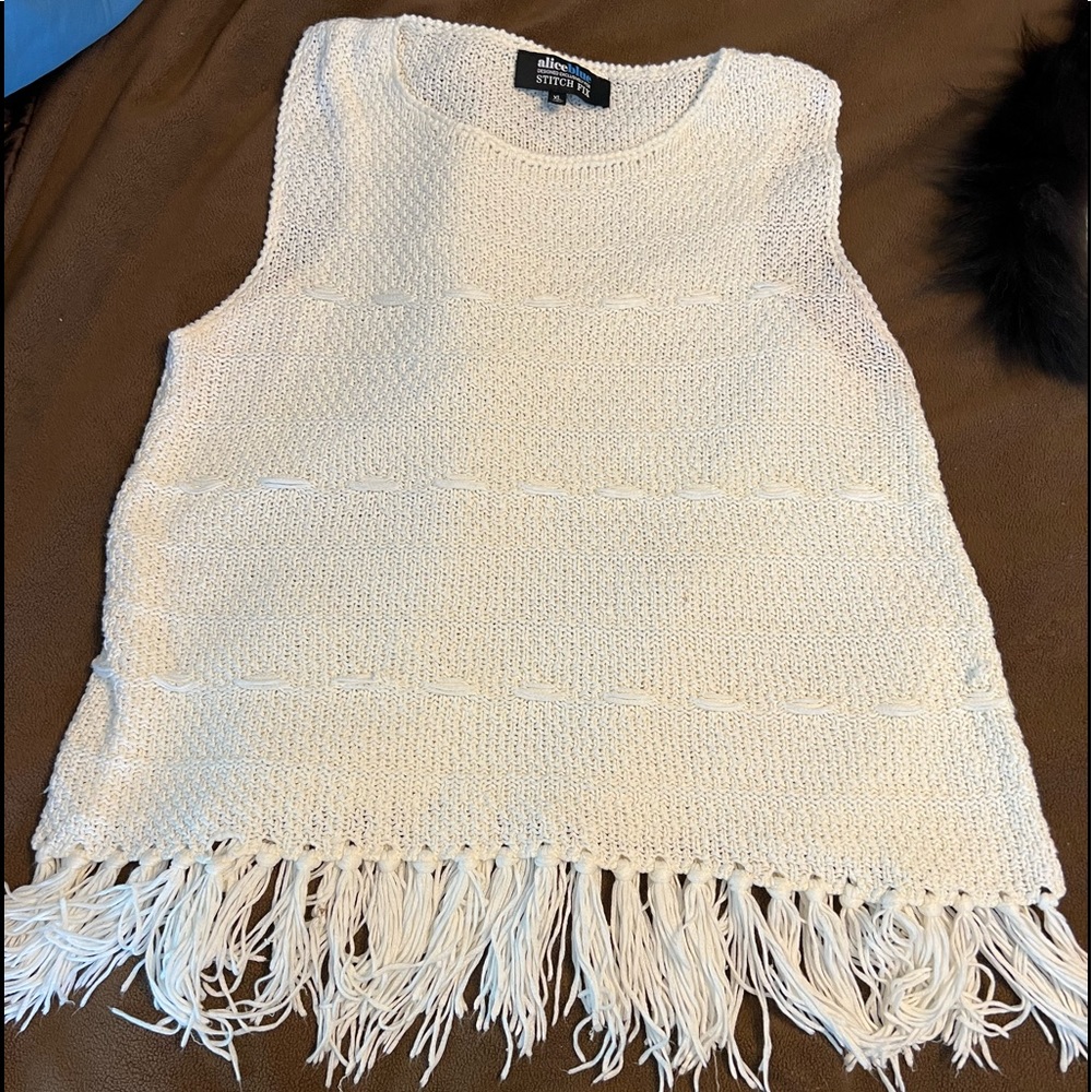 Sleeveless sweater. Very soft. XL, Fringe on bottom. No tags, but never warn